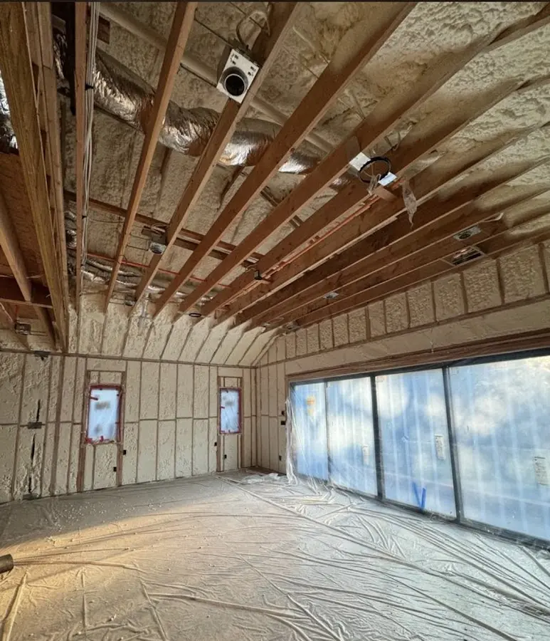 Interior walls and ceiling insulated with spray foam during new construction in Corona